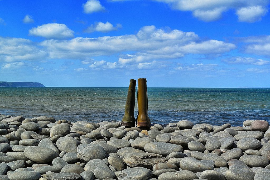 Rubber boots on the beach