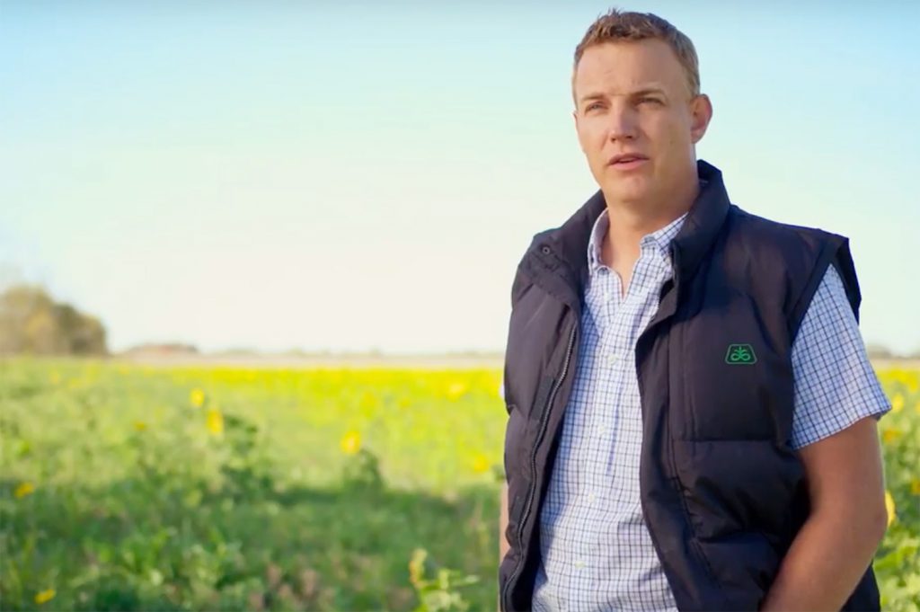 farmer Dave McEachren standing in front of a field