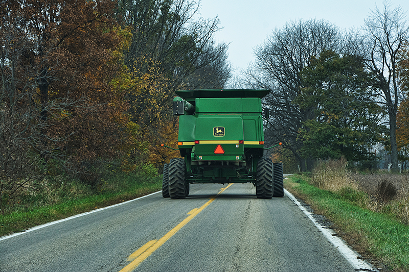 road safety. combine on road during harvest