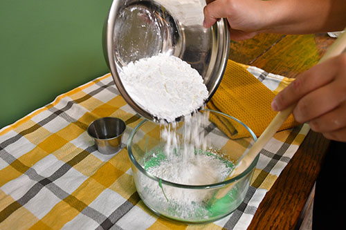 Adding Corn Starch to the glue and dishsoap to make corn slime