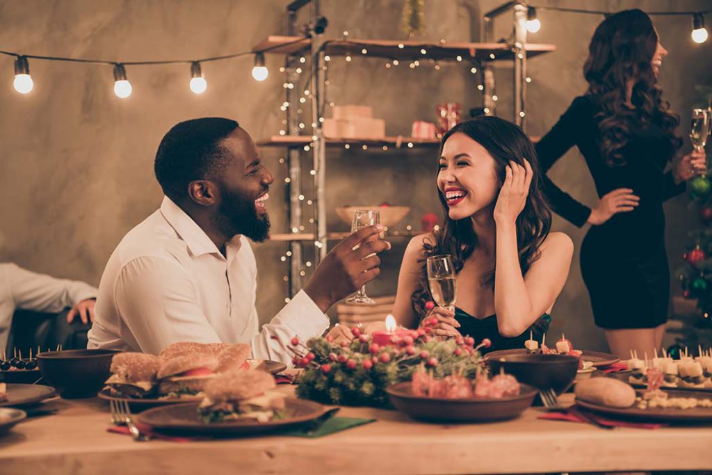 small holiday gathering with man and woman talking