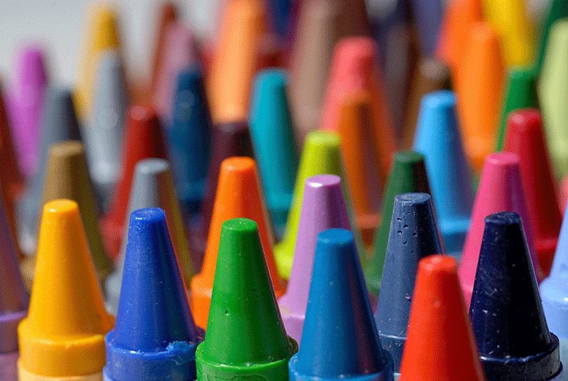colourful crayons standing upright