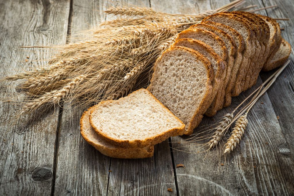 fresh bread and wheat on the wooden